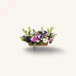 bouquet pivoines Genève : pivoines roses, mufliers et eryngium bleu — hommage funéraire élégant