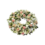 couronne de deuil Genève : roses pastel, marguerites et chrysanthèmes pour un hommage élégant