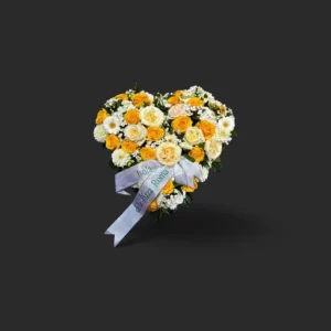 bouquet deuil Genève : cœur de roses jaunes et blanches, chrysanthèmes et gerberas avec ruban argenté