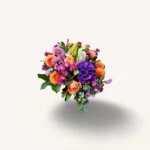 bouquet coloré Genève : dahlias orangés, roses pêche, lys blancs et hortensia violet en composition élégante