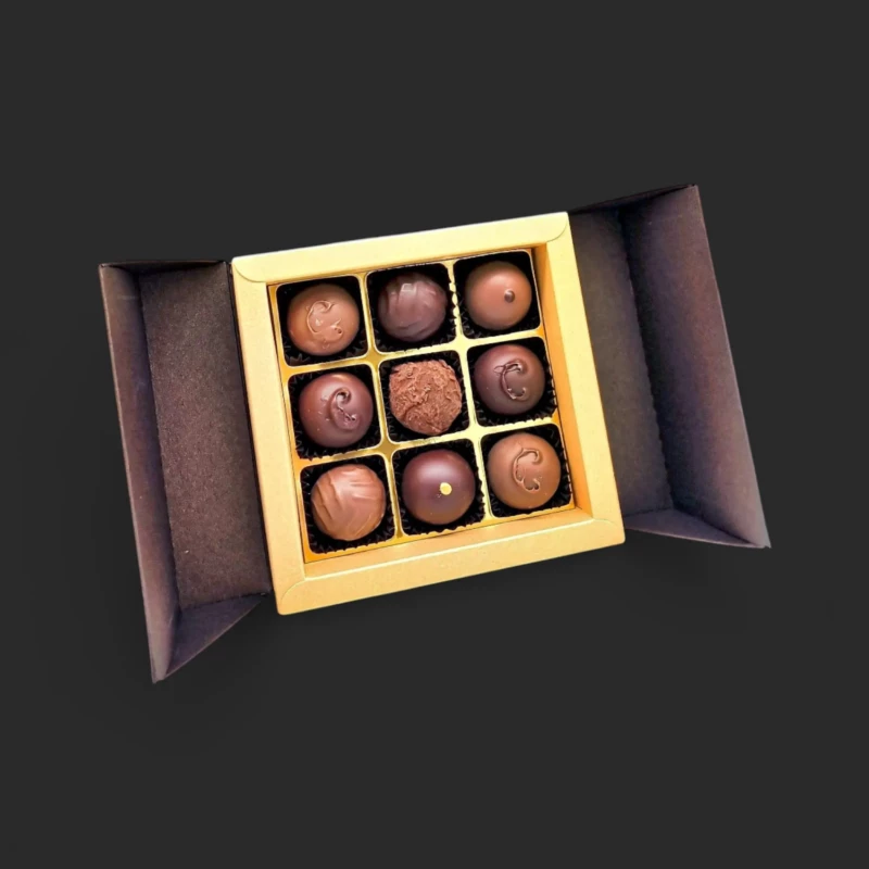 ruban de sepia geneve - coffret de 9 truffes au champagne en boîte dorée, cadeau gourmand à Genève