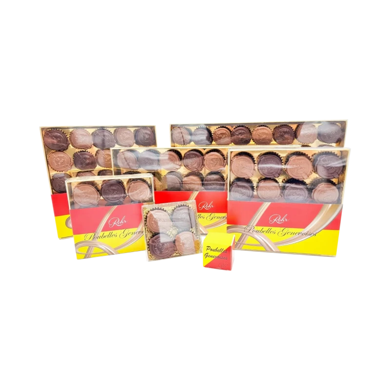 Plusieurs boîtes du coffret chocolat Genève 'Les Poubelles Genevoises' remplies de chocolats noirs et au lait sur fond noir.