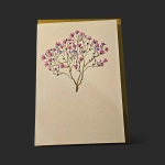 Carte condoléances Genève magnolia dorure, arbre en fleurs aux branches dorées sur papier crème